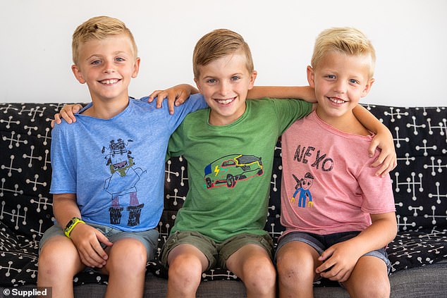 Jack had always enjoyed drawing, and Ms Sturgess said she found art therapy was very helpful for her son (pictured centre with his brothers). They then decided to turn his drawings into a t-shirt line that raised money for Kid