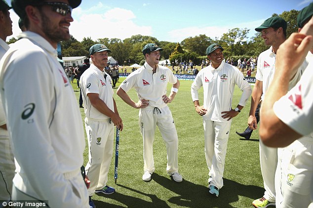 Team player: Usman pictured with team mates David Warner and Steve Smith in February after day five of the Test match between New Zealand and Australia in Christchurch 